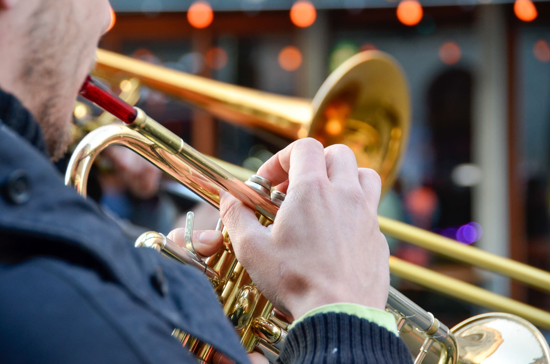 man holding trombone