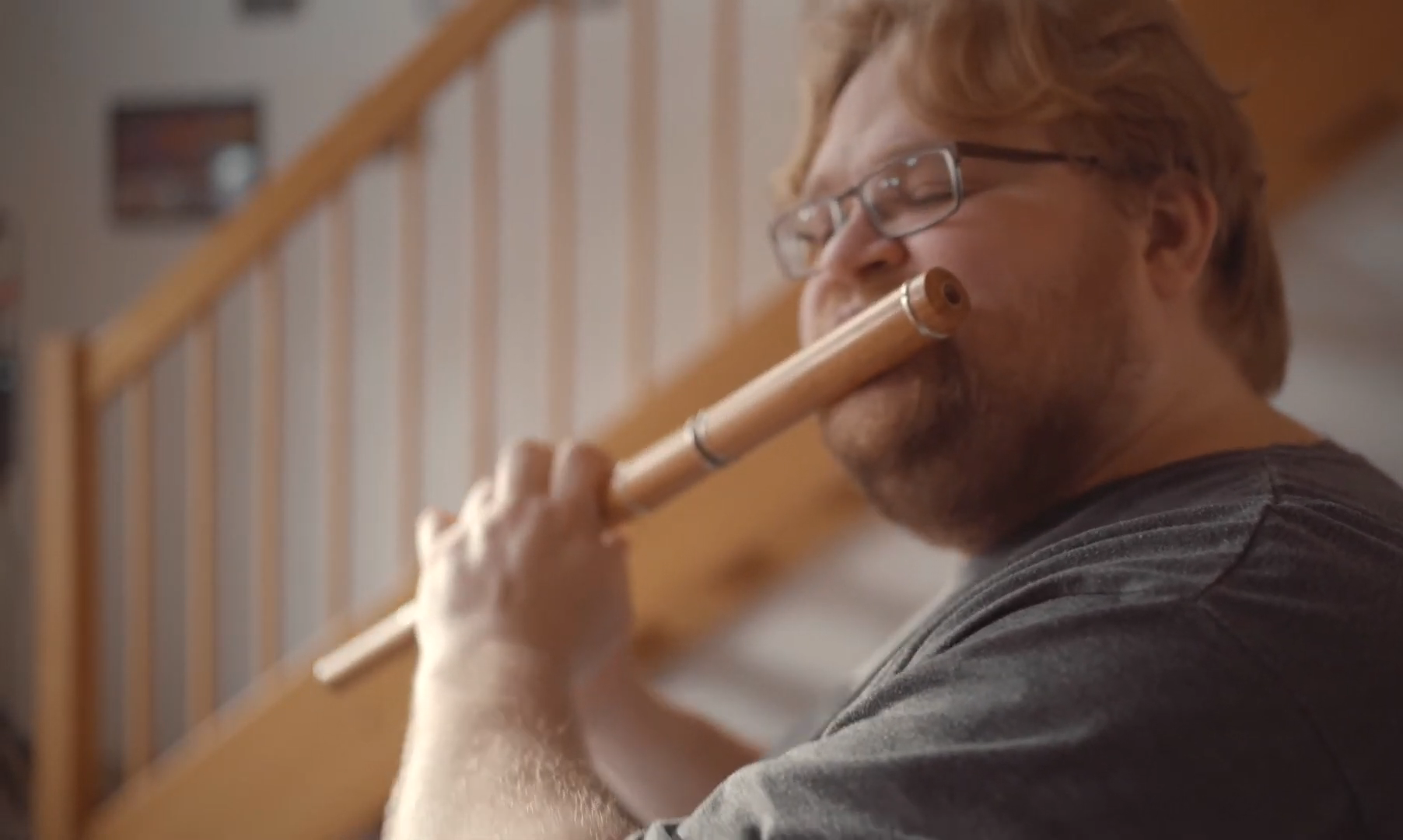 man playing irish wooden flute